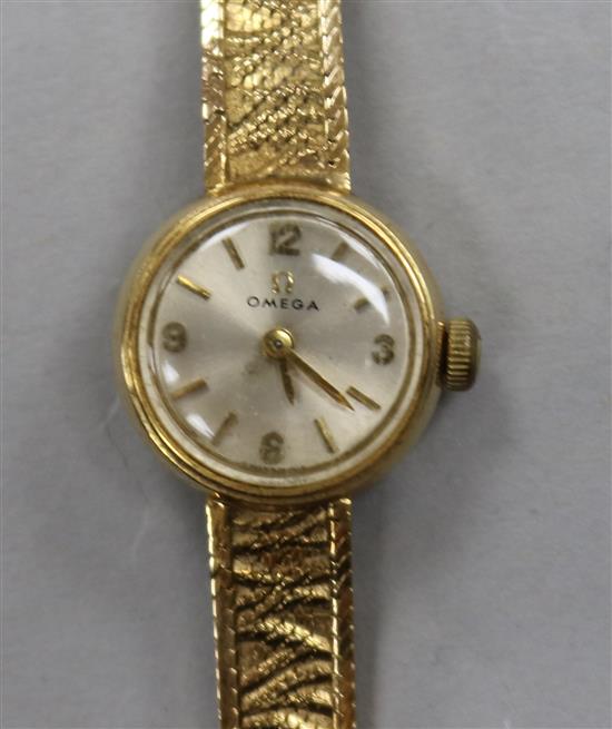 A ladys 9ct gold Omega dress watch on textured bracelet